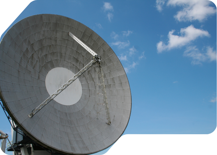 A large metal dish mounted on a pole